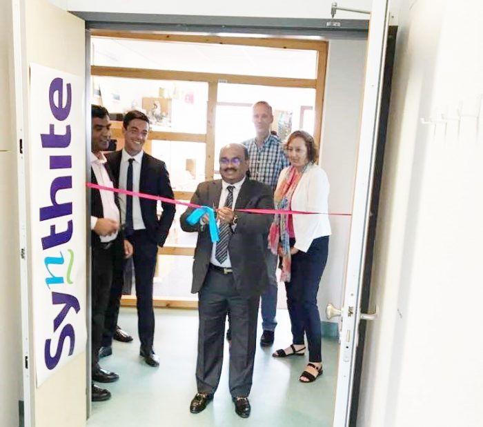 Dr. Viju Jacob, Managing Director of the Synthite Group, cuts the ribbon at the inauguration of Synthite's European office in Holland. 