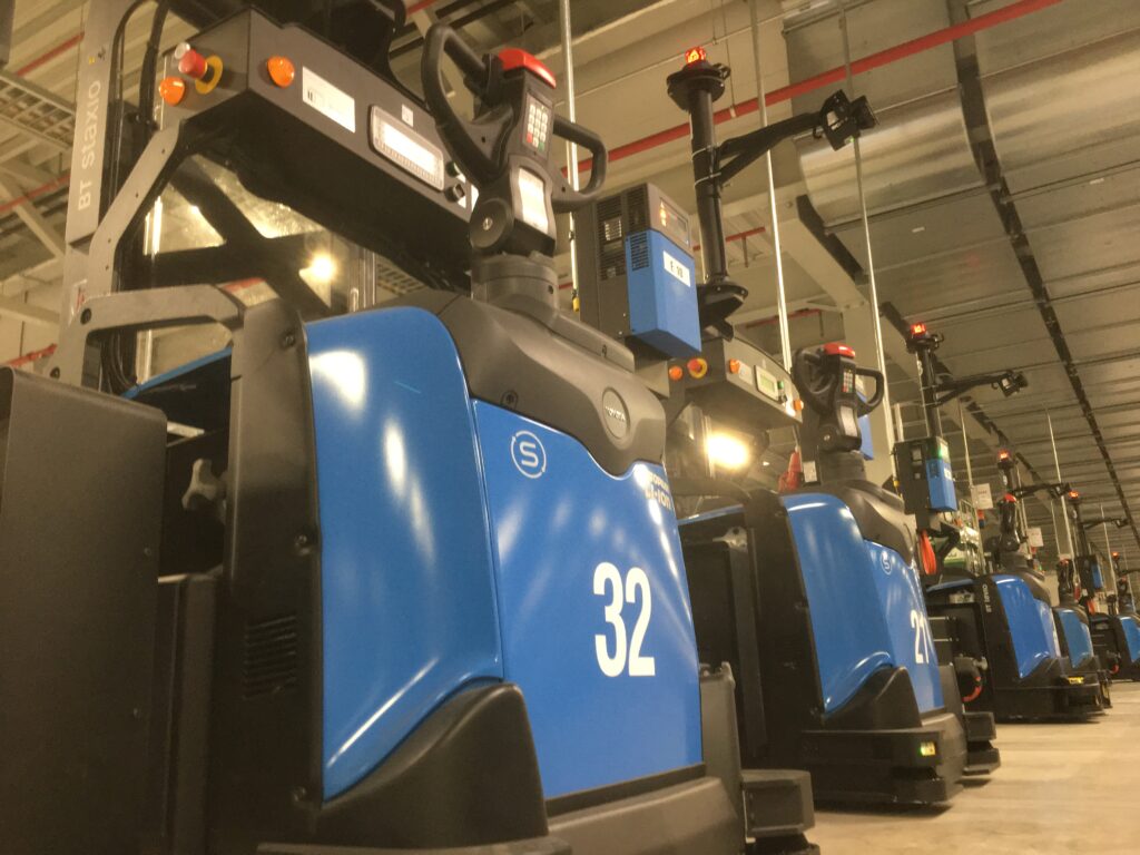 blue autonomous vehicle in a warehouse