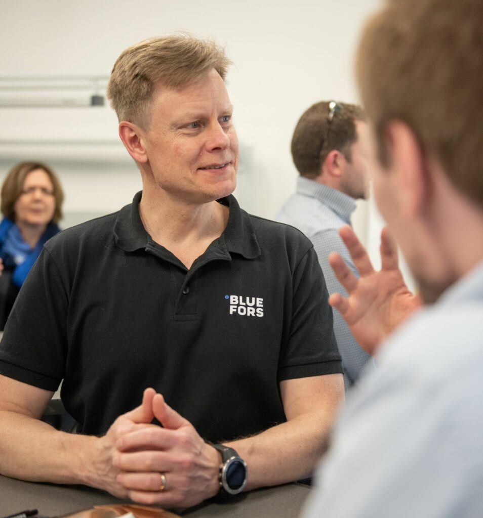 Director of Services Sami Nyman in a black polo at the Bluefors Delft lab.