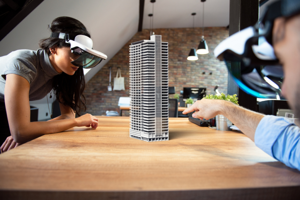 Two people wearing augmented reality headsets inspect a virtual building. Invest in Holland.