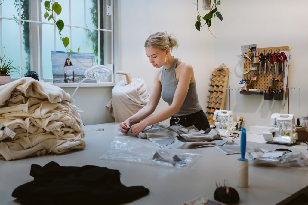 Fashion designer working in a studio. Invest in Holland.